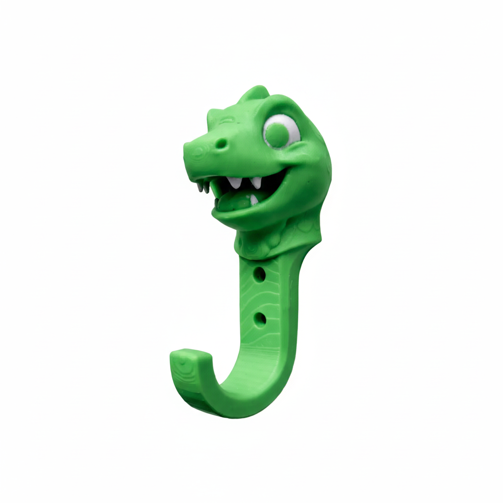 Green dinosaur-shaped hook on a white background
